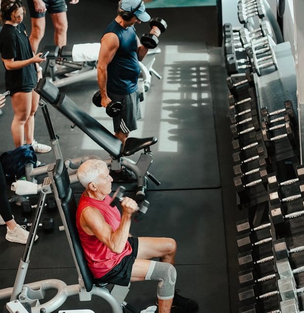 Members training on the free-weight floor at Grayton Beach Fitness